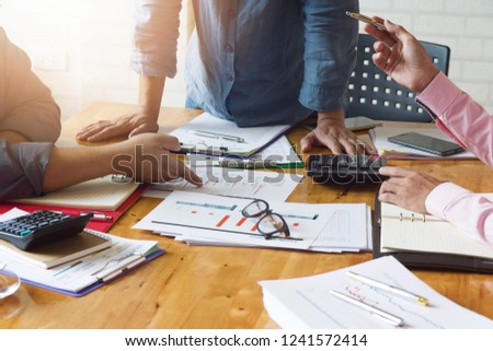 Business and finance concept of office working, Team of Businessmen discussing analysis Chart