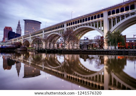 Detroit Superior Bridge over Cuyahoga River and downtown skyline at sunset in Cleveland, Ohio, USA