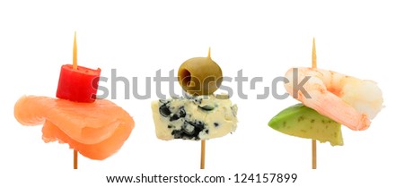 Bitesize party snacks, salmon, cheese and prawn on cocktail sticks Royalty-Free Stock Photo #124157899