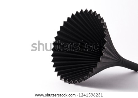 Black plastic funnel on white background