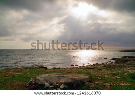 The sun breaks through the clouds above the sea . Tarhankut. Crimea