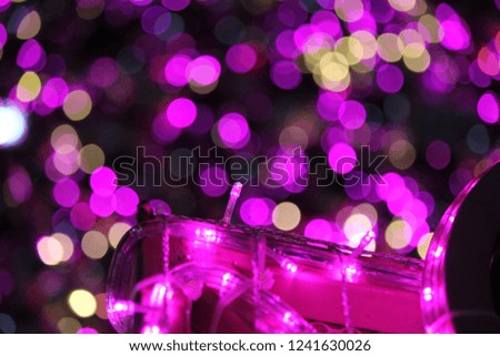 Abstract bokeh background of Christmas lights. Toned image