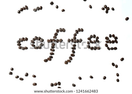 Dark roasted coffee bean made in coffee word on white background