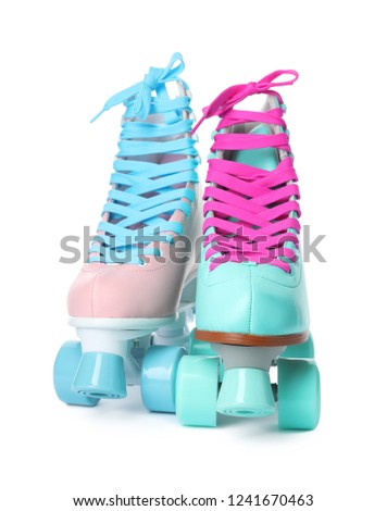 Bright stylish roller skates on white background