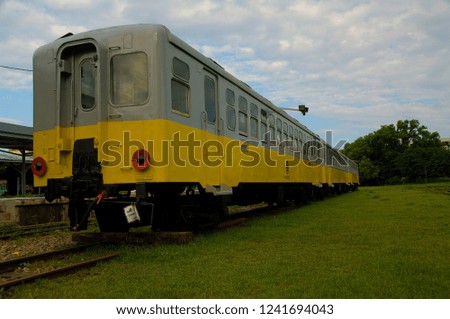 Abandoned train cars parked on the grass are new tourist attractions.