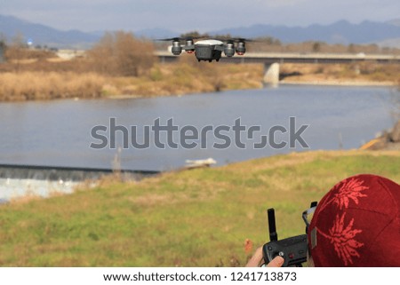 man playing with drone