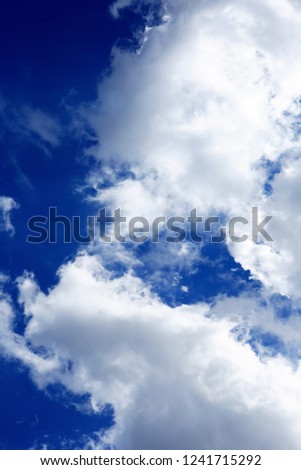 Nice natural background with white clouds against blue sky