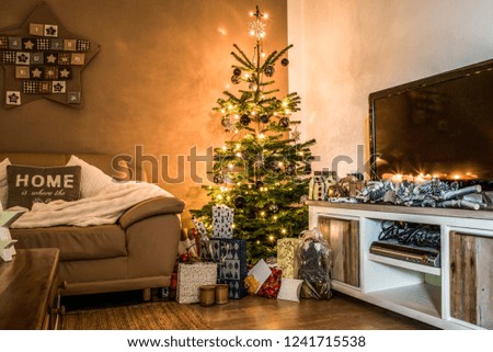 Merry Christmas beautiful living room tree setup aith gifts decorated for Happy Holidays at home