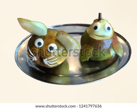 Decoration of pears on a silver plate