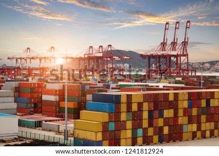 Logistics and transportation of Container Cargo ship and Cargo plane with working crane bridge in shipyard, logistic import export and transport industry background Royalty-Free Stock Photo #1241812924