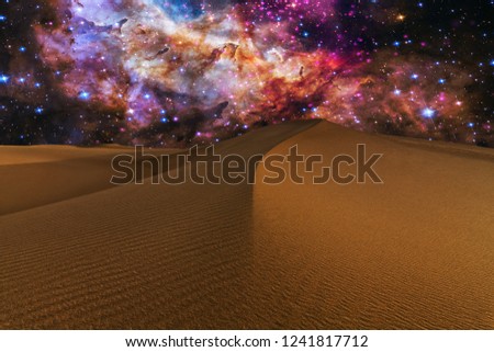 Amazing views of the Sahara desert under the night starry sky. Elements of the image furnished by NASA