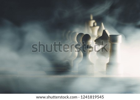 chess pieces in white fog, close up
