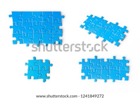 Blue puzzles on white background. Set of blue puzzles. Isolated on white. Business and education