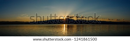 Panorama,Light and shadow of the sunset at Phayao Reservoir, Phayao Province, Thailand.