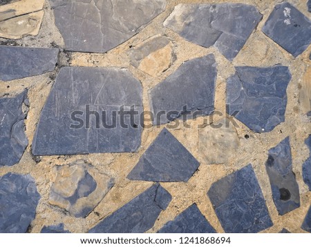 Stone floor texture, Abstract background of stone wall made of large stones and cement