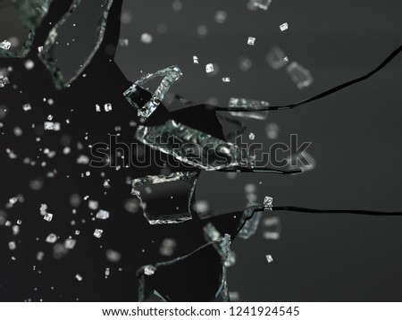 Shattered broken glass pieces in a studio that have been shot