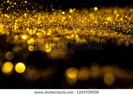 Explosive blur gold powder light christmas and  happy new year. 