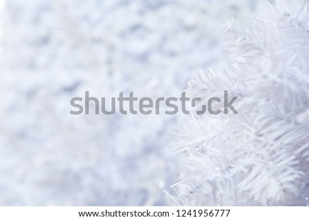 White Christmas tree background with blurred snow effect