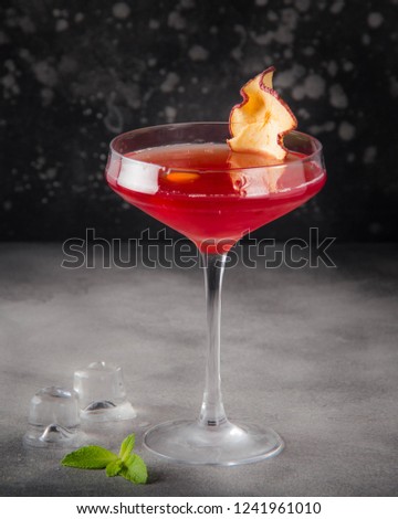 Red orange cocktail in the glass, delicious alcoholic drink to celebrate