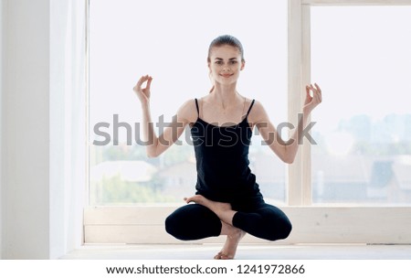 woman standing in yoga pose asana                      