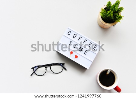 COFFEE TIME text on lightbox composition on white table background copy space