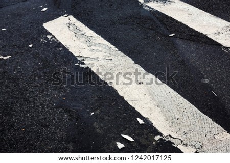 Road markings on asphalt on the street of Manhattan in New York City. Pedestrian crossing on the road in NYC