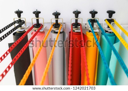 many colorful paper backgrounds for a photo studio