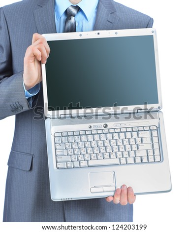 The young businessman keeps the laptop. Isolated on a white background.