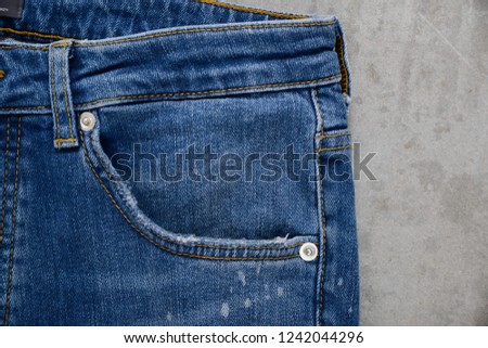 Front view blue jeans Blue jeans-gray background
