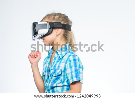 Digital future and innovation. Little child in VR headset. Small child wear wireless VR glasses. Happy kid use modern technology. Little girl wearing virtual reality goggles. Using VR technologies.