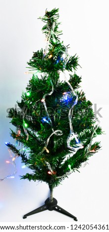 Christmas tree decorated with small lights. on the white background.