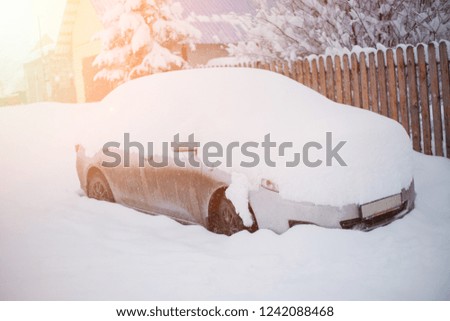 covered with snow stop signals sports car. winter day