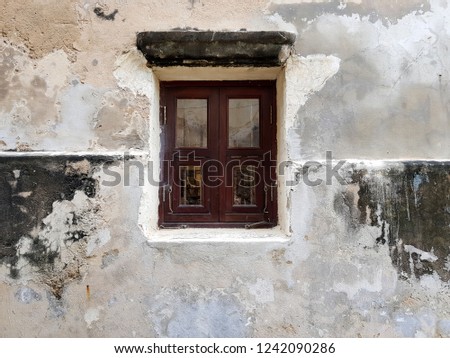Vintage wooden window and old cement wall