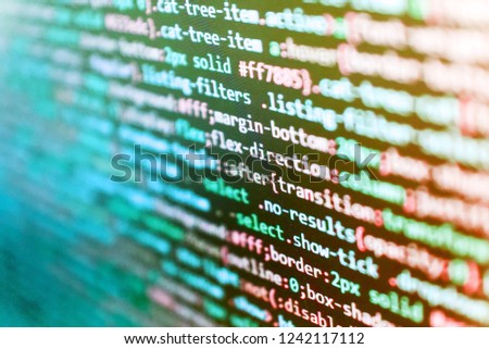 Software abstract background. Notebook closeup photo. Modern tech. Web site codes on computer monitor Blurred screen with selective focus. Abstract screen of software virus and coding technologies. 