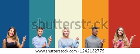 Collage of group of young people over colorful vintage isolated background with a big smile on face, pointing with hand and finger to the side looking at the camera.