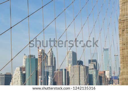 Manhattan's skyscrapers behind the Brooklyn bridge in New York City