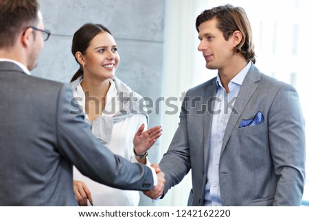 Group of business people introducing one another