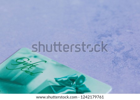 Gift card on color background.