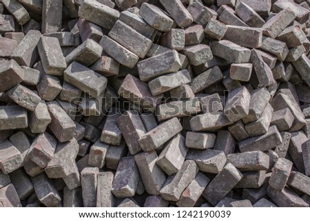 Heap of cobblestones background, paving stone building material at construction site