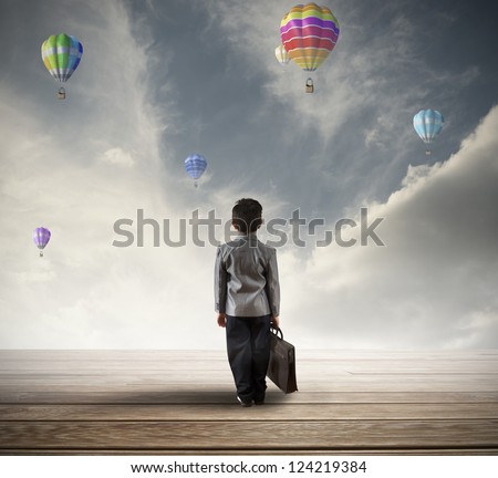 Young hopeful businessman searching for his future Royalty-Free Stock Photo #124219384