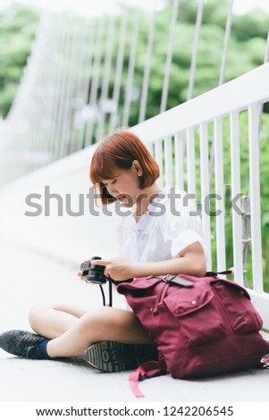 Female woman tourism lifestyle use camera photographer travel taking shooting photo in park
