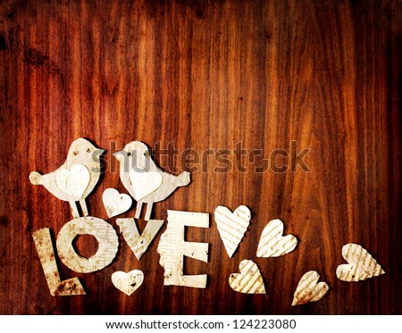 Vintage holidays card with a two birds and heart as a symbol of love/valentines day card with word "love"
