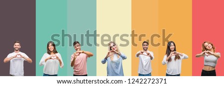 Collage of different ethnics young people over colorful stripes isolated background smiling in love showing heart symbol and shape with hands. Romantic concept.