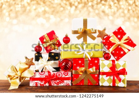 Minimalistic festive composition with wrapped presents, colorful matte christmas balls. Fancy beautiful decoration for christmas pine tree. Background, copy space, close up, front view.