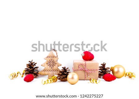 Minimalistic festive composition with presents wrapped in craft paper, colorful matte christmas balls. Fancy beautiful decoration for christmas pine tree. Background, copy space, close up, front view.