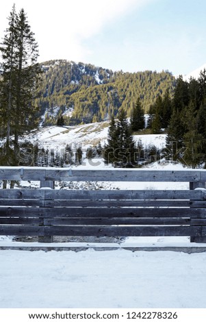 snowy mountain view behind the wooden at fence austria ischgl
