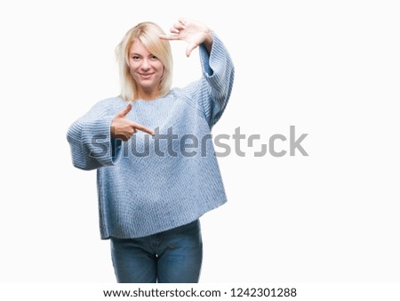Young beautiful blonde woman wearing winter sweater over isolated background smiling making frame with hands and fingers with happy face. Creativity and photography concept.