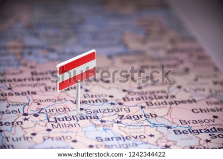 Austria marked with a flag on the map