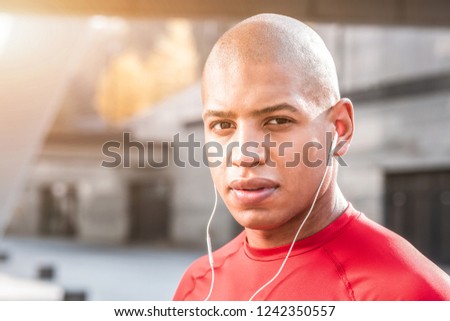 Young sportsman. Portrait of an afro American man while looking at you