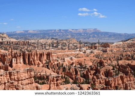 Scenic view of vibrant sunlight reflection on pinnacle rock formations in intersection between rim trail and Navajo loop trail, Bryce Canyon National Park